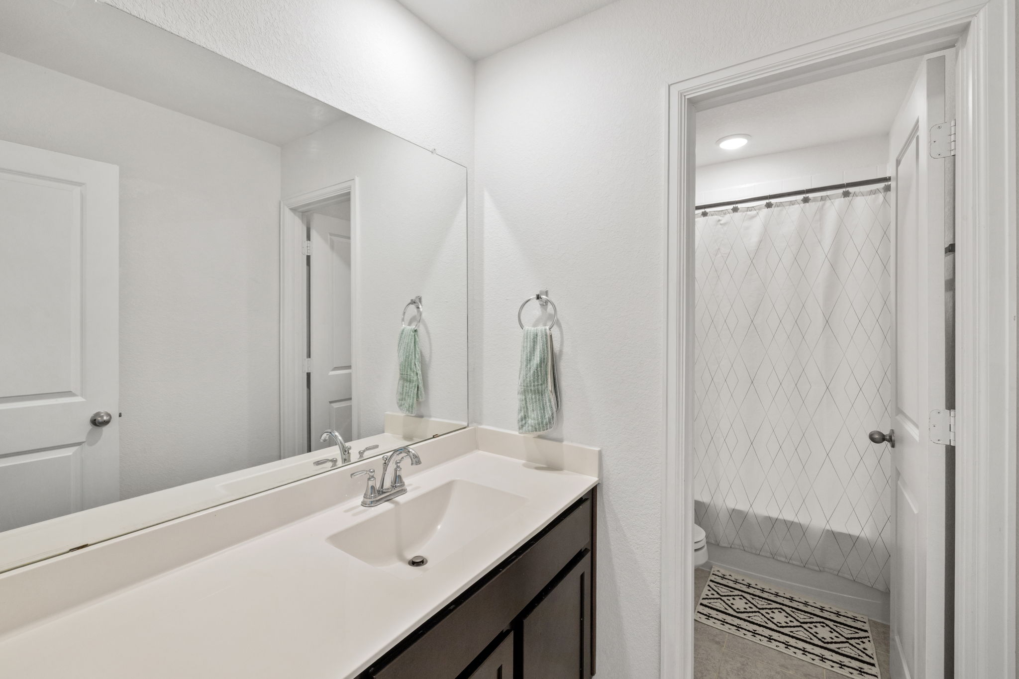 189 Durian Loop Buda, TX 78610 - Photo 23 of 38 Full bathroom featuring vanity and shower / bath combo with shower curtain