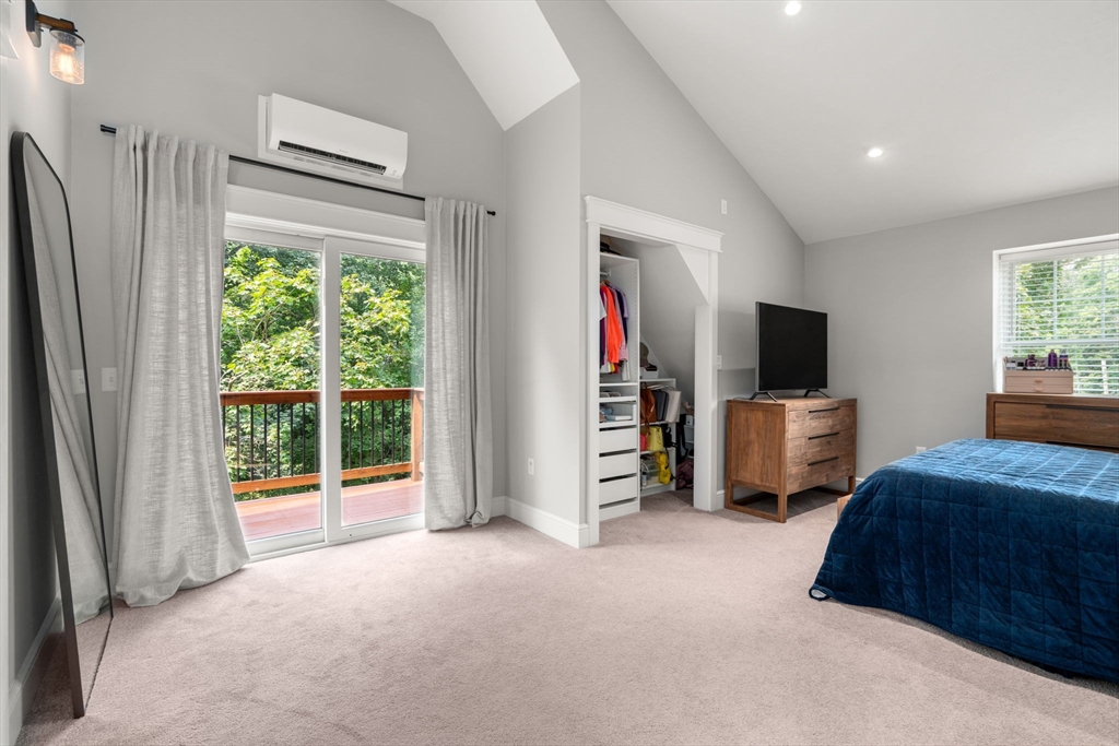 21 Prospect Street Maynard, MA 01754 - Photo 23 of 40 a bedroom with furniture and a flat screen tv