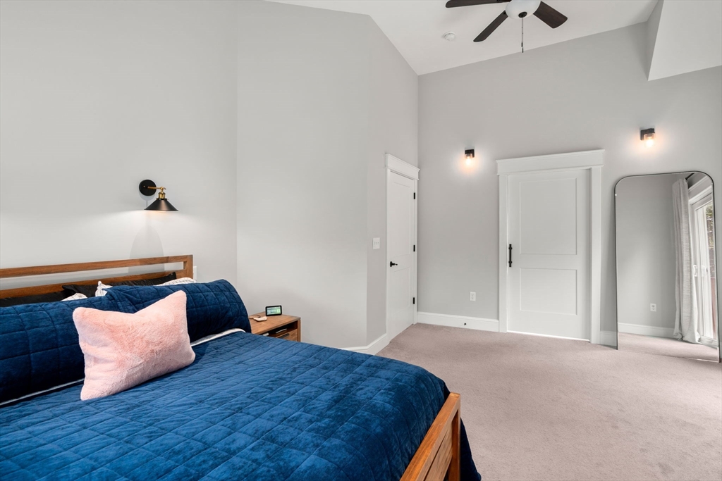 21 Prospect Street Maynard, MA 01754 - Photo 24 of 40 a bedroom with a bed and a night stand