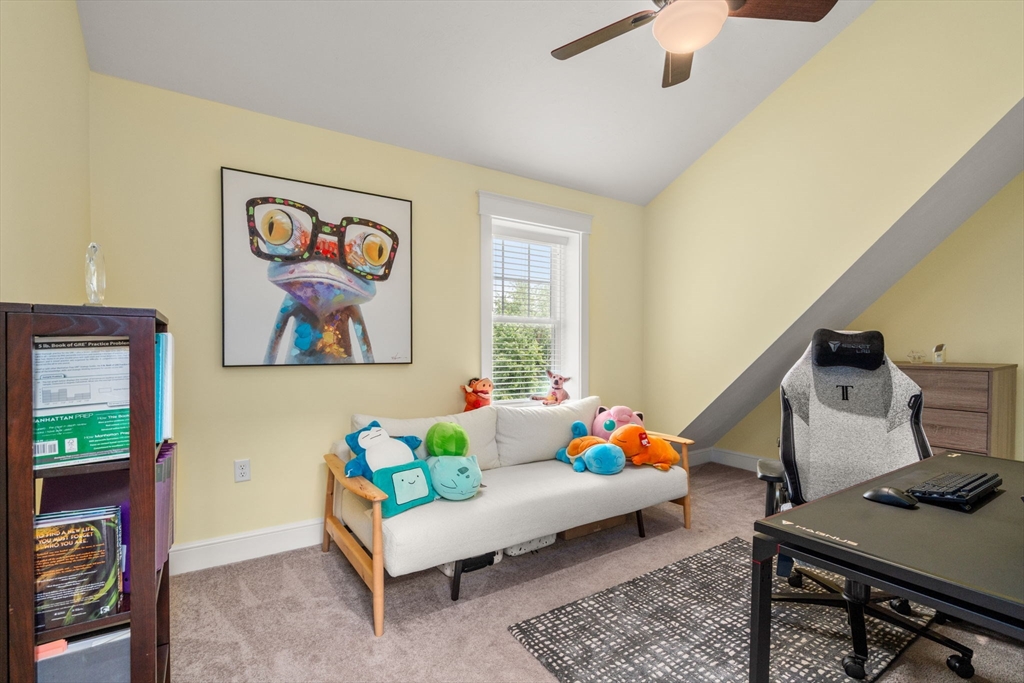 21 Prospect Street Maynard, MA 01754 - Photo 30 of 40 a living room with furniture and a flat screen tv