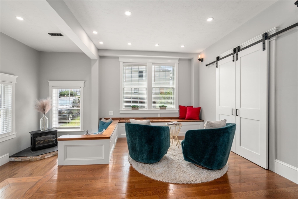 21 Prospect Street Maynard, MA 01754 - Photo 6 of 40 a living room with a couch and a table