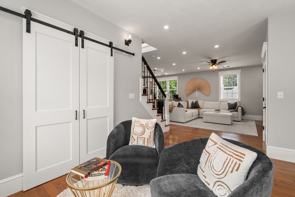 21 Prospect Street Maynard, MA 01754 - Photo 8 of 40 a living room with furniture and a wooden floor