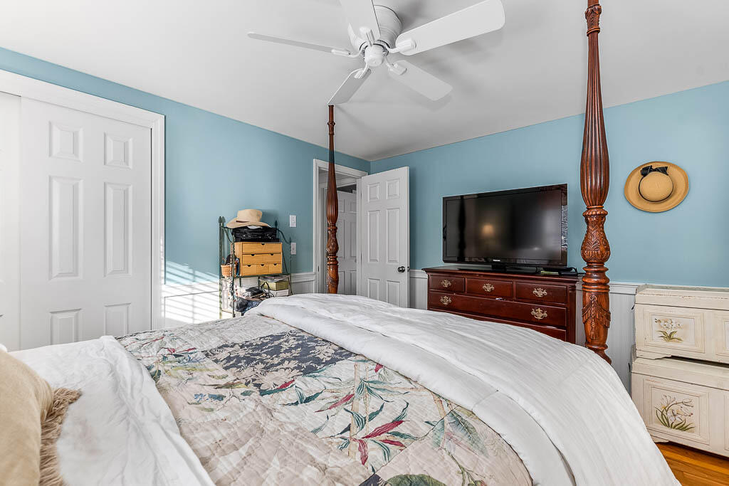 21 Spinning Brook Road South Yarmouth, MA 02664 - Photo 14 of 21 a bedroom with a bed and a flat screen tv