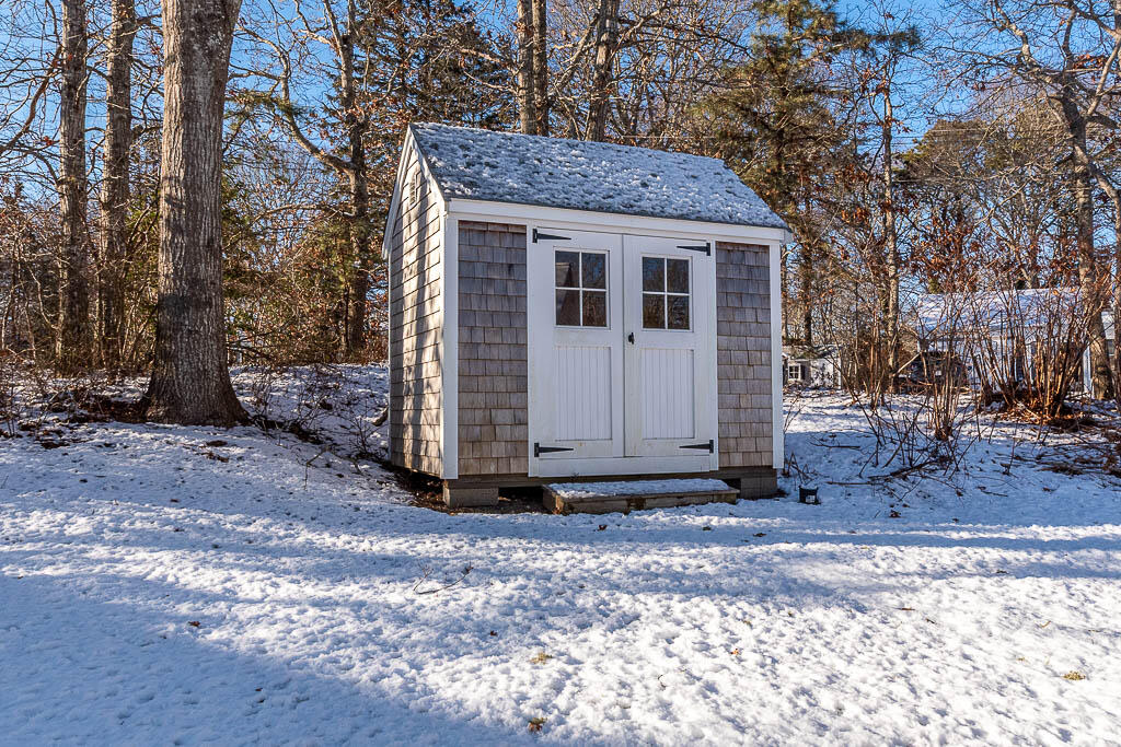 21 Spinning Brook Road South Yarmouth, MA 02664 - Photo 20 of 21 a view of a house with a yard
