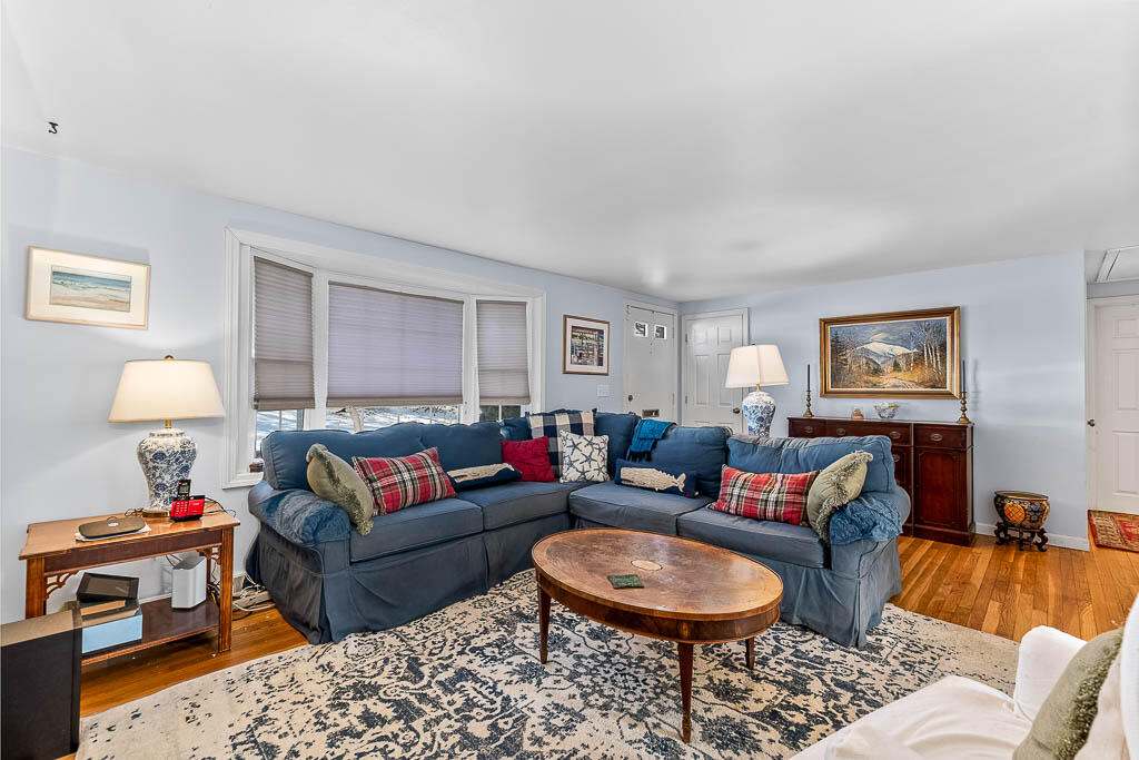 21 Spinning Brook Road South Yarmouth, MA 02664 - Photo 5 of 21 a living room with furniture a rug and a lamp