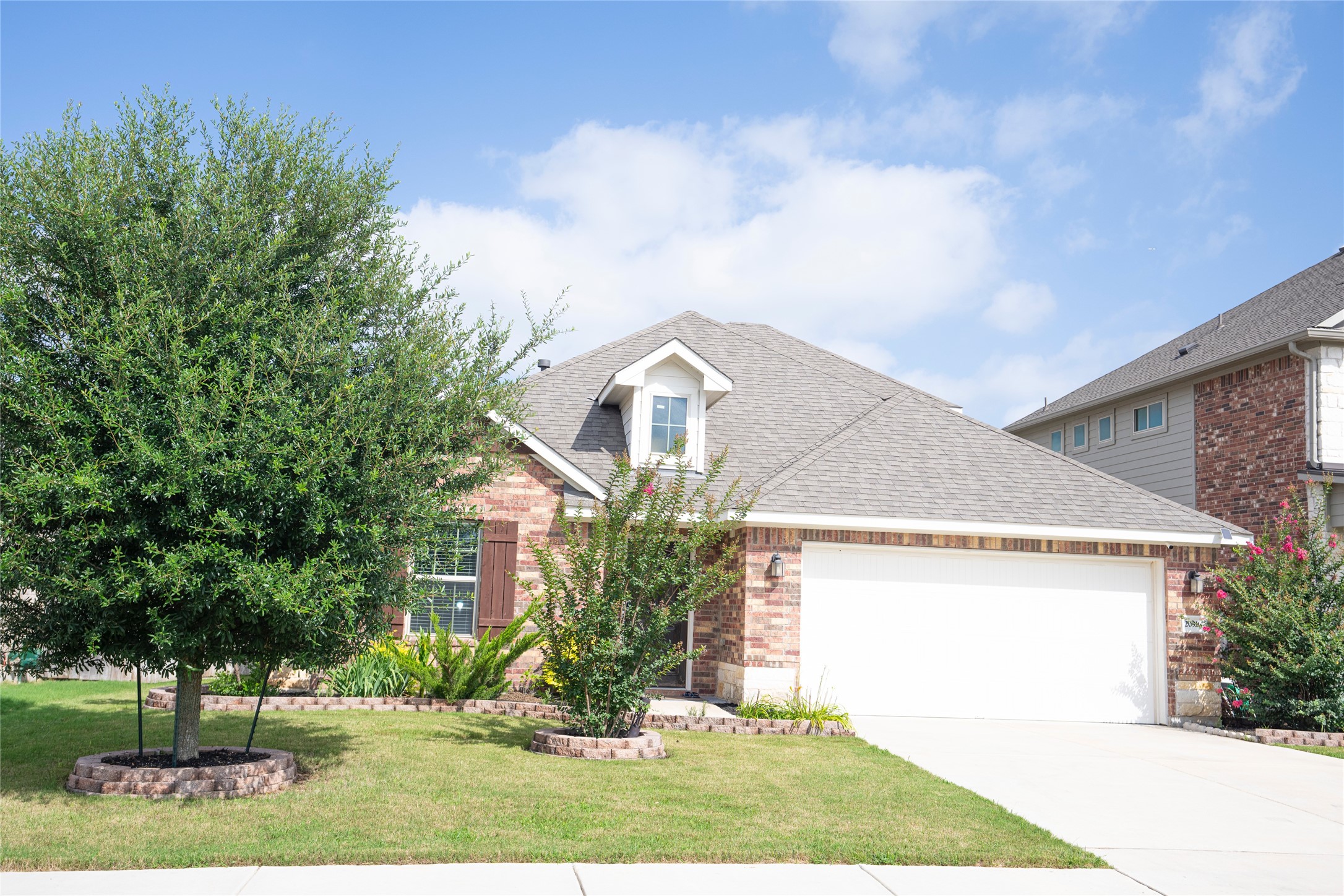 20916 Carries Ranch Road Pflugerville, TX 78660 - Photo 4 of 40 a front view of a house with garden