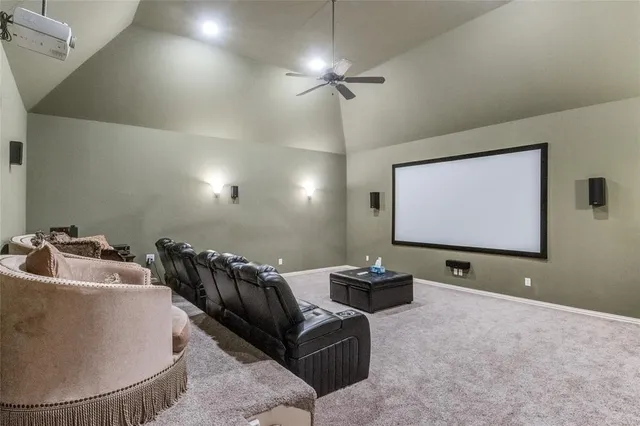 a projector room with table chairs and a projector screen