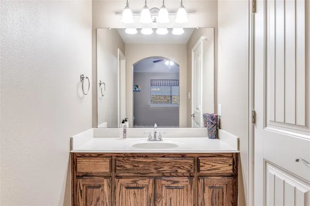 a bathroom with a sink and a mirror