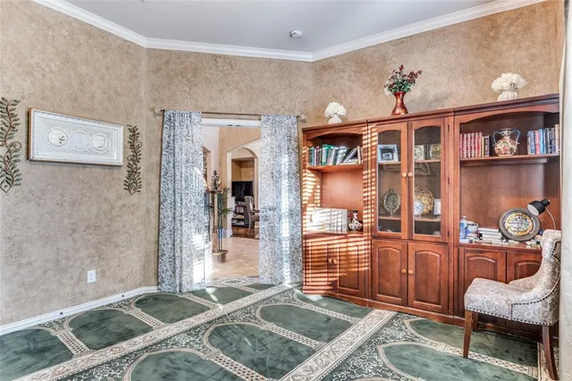 a bedroom with furniture and a rug