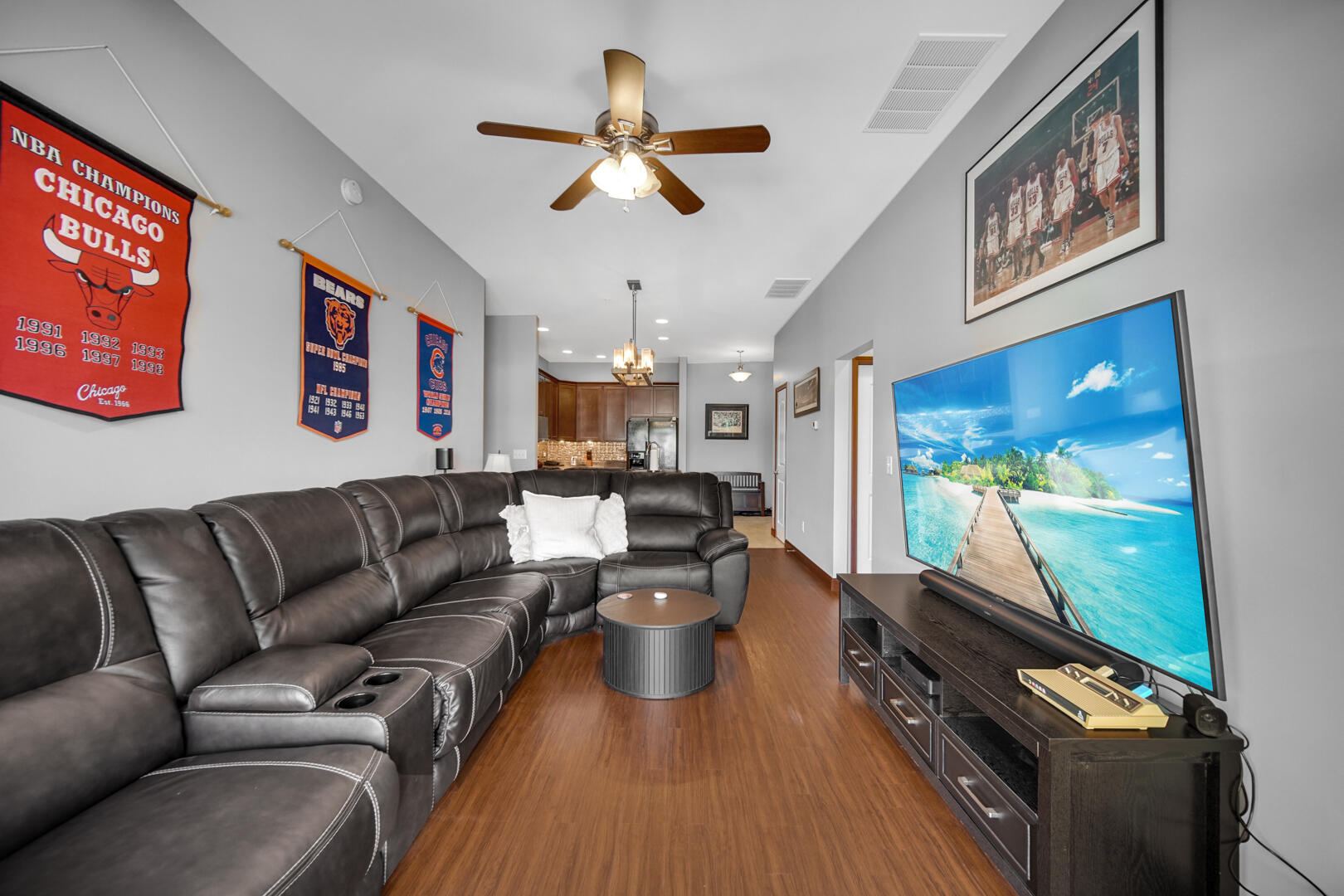 123 North Main Street, Unit 301 Crown Point, IN 46307 - Photo 5 of 25 a living room with furniture and a flat screen tv