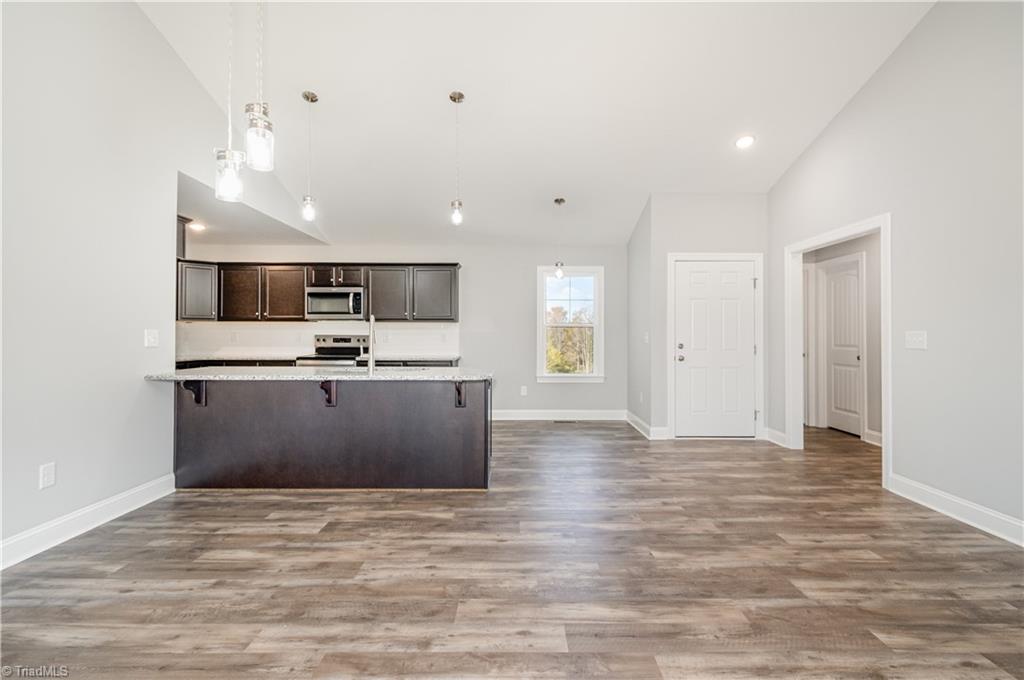 143 Knight Farm Road Stokesdale, NC 27357 - Photo 4 of 26 Dining and Kitchen View from Living Room