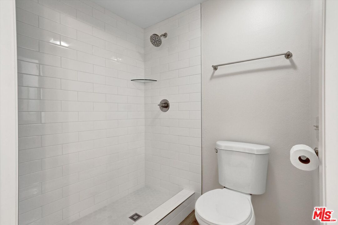 82 Eagle Point, Unit 43 Irvine, CA 92604 - Photo 15 of 35 a white toilet sitting next to a bathroom shower