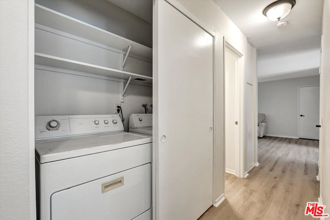 82 Eagle Point, Unit 43 Irvine, CA 92604 - Photo 22 of 35 a view of storage and utility room with washer and dryer