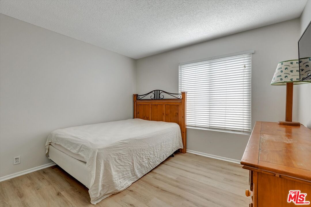 82 Eagle Point, Unit 43 Irvine, CA 92604 - Photo 25 of 35 a room with a bed and a window