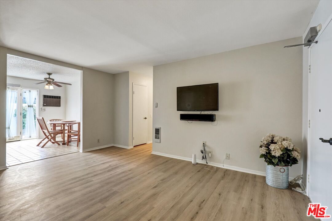 82 Eagle Point, Unit 43 Irvine, CA 92604 - Photo 8 of 35 a living room with furniture and a flat screen tv