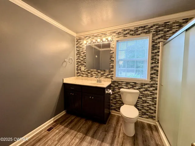 a bathroom with a sink and a toilet