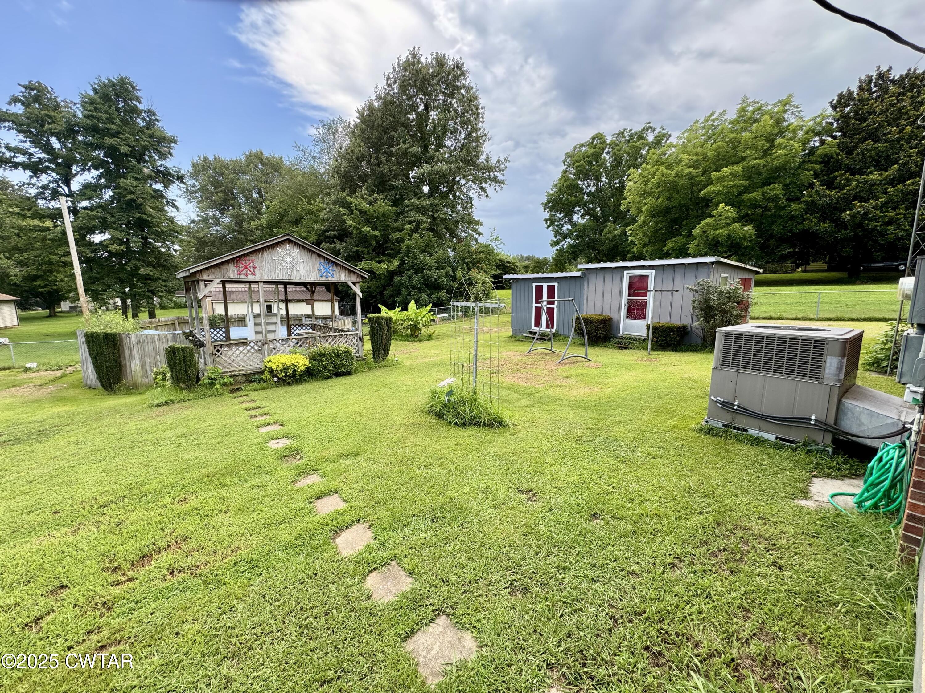 4985 McClard Road Union City, TN 38261 - Photo 18 of 27 a house view with a garden space