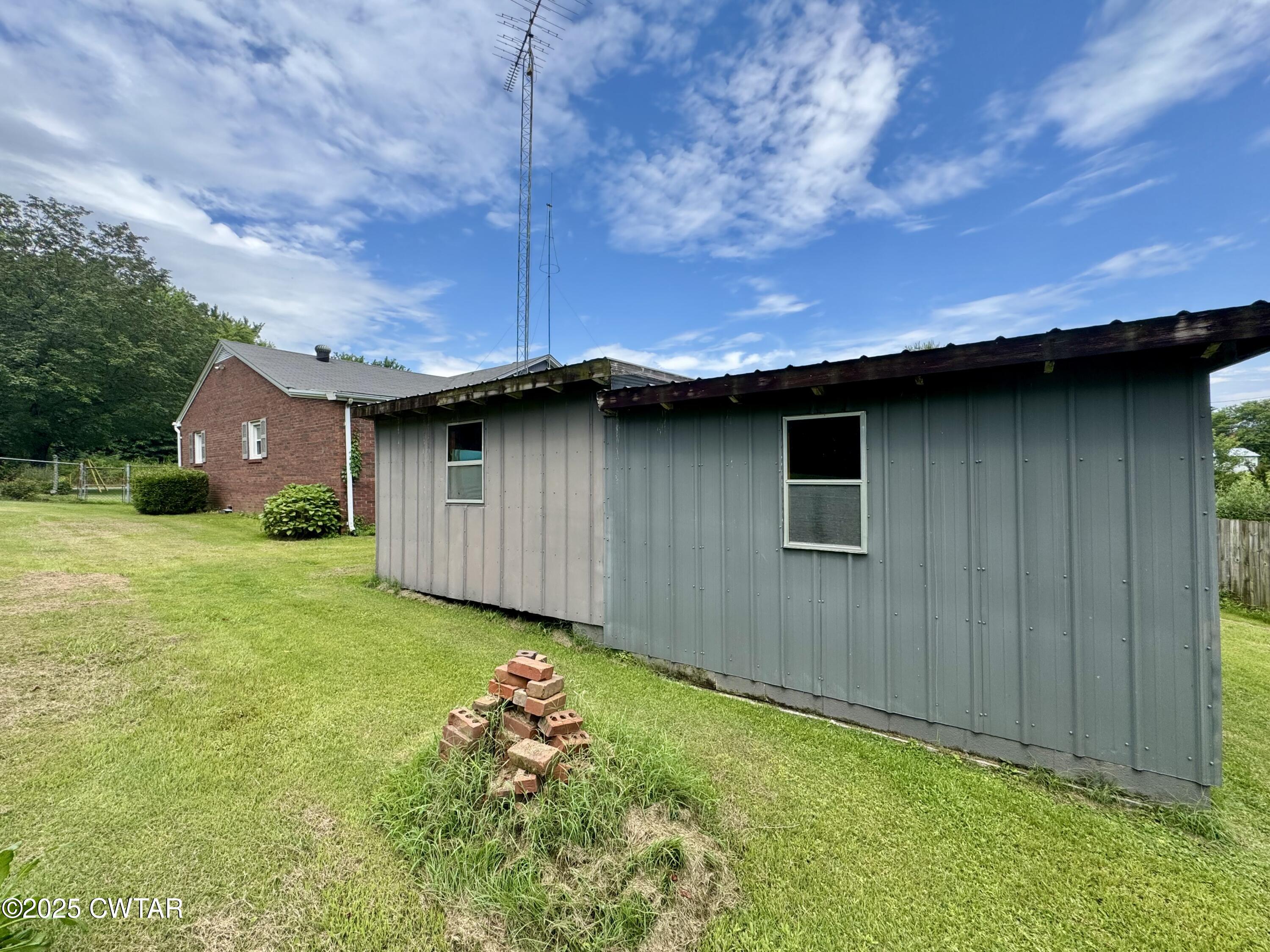 4985 McClard Road Union City, TN 38261 - Photo 20 of 27 a view of a backyard with potted plants