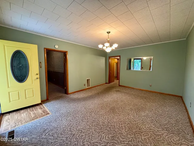 a view of a hallway with washer and dryer
