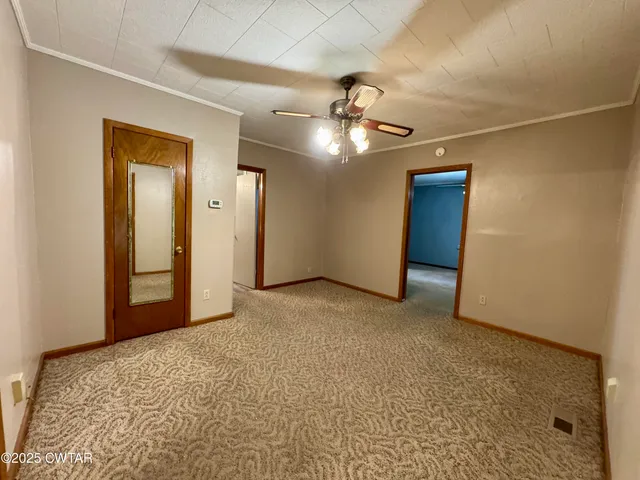 a view of a livingroom with a ceiling fan