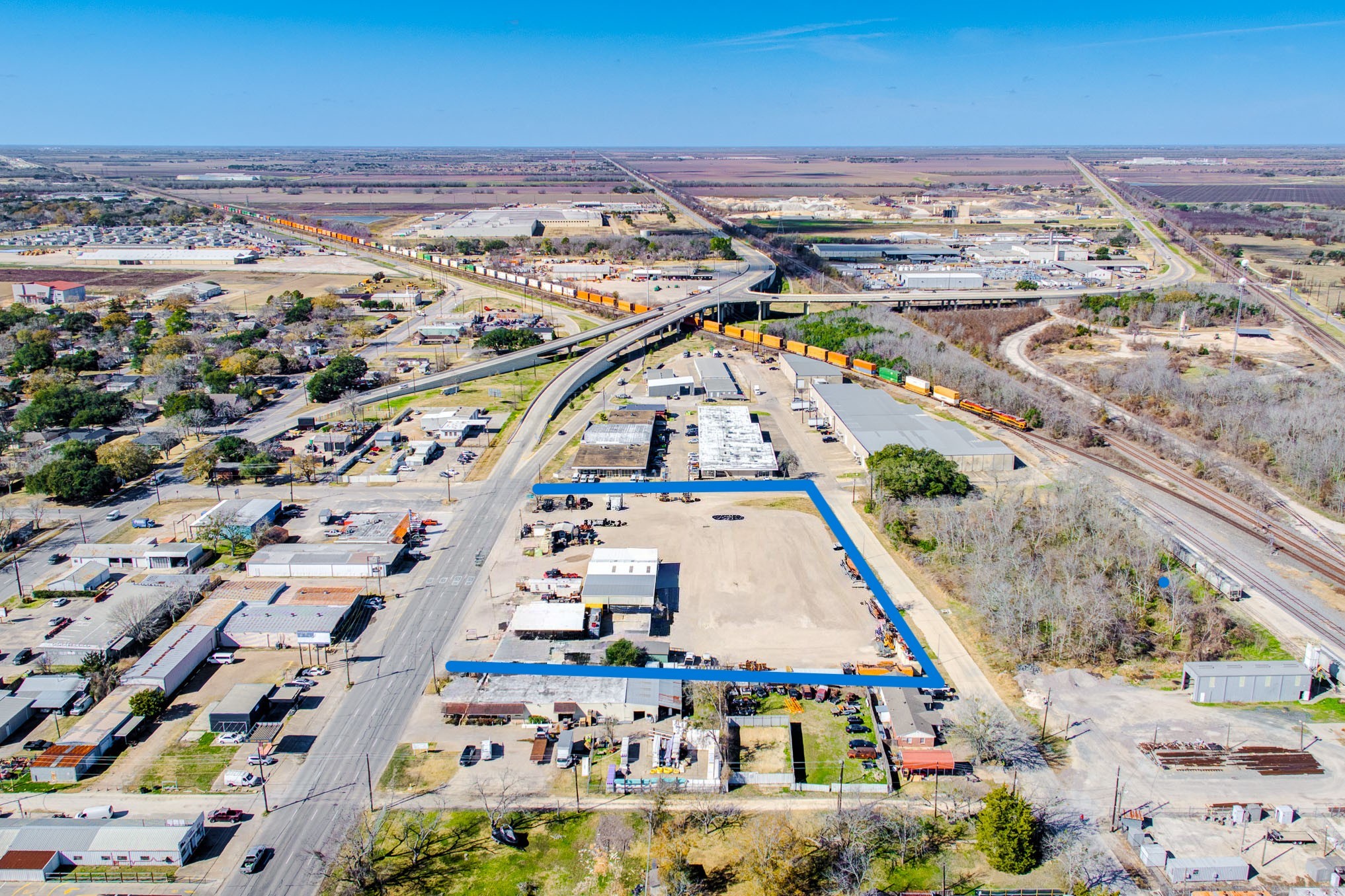 1215 Avenue H Rosenberg, TX 77471 - Photo 2 of 8 an aerial view of residential houses with outdoor space