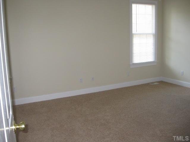 3709 Barwell Road Raleigh, NC 27610 - Photo 11 of 25 an empty room with a window