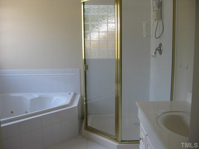 3709 Barwell Road Raleigh, NC 27610 - Photo 14 of 25 a bathroom with a bathtub and shower