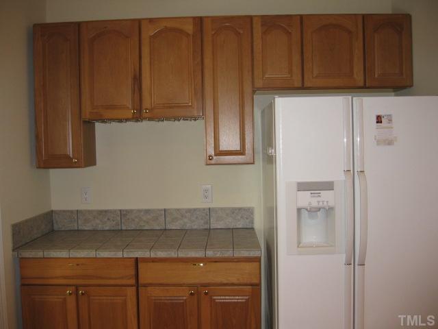 3709 Barwell Road Raleigh, NC 27610 - Photo 10 of 25 a kitchen with cabinets