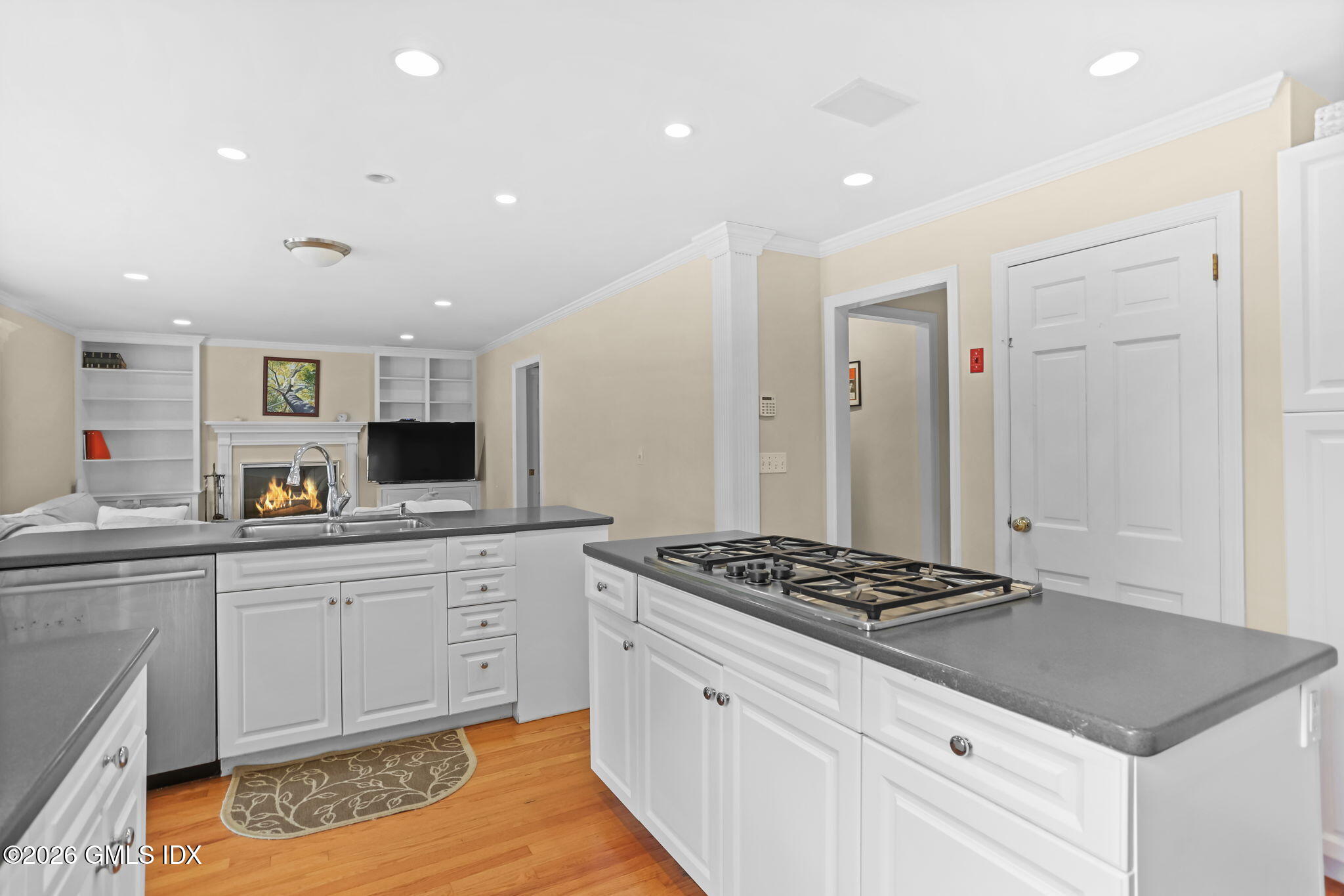 153 Lockwood Road Riverside, CT 06878 - Photo 17 of 58 a kitchen with stainless steel appliances granite countertop a sink stove and cabinets