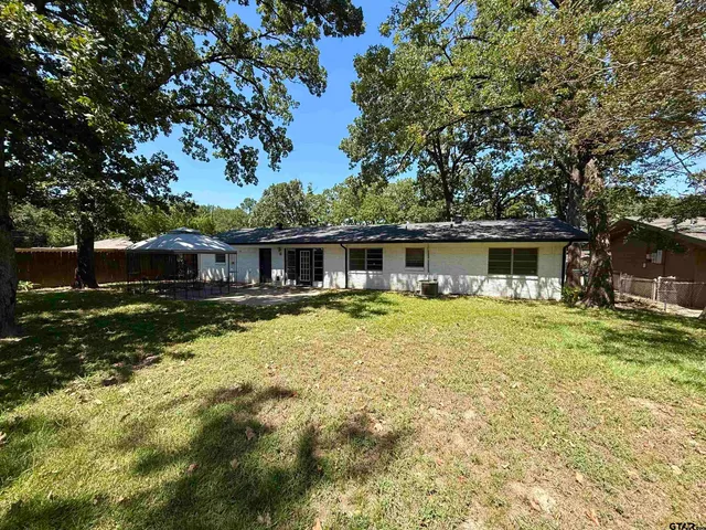 a view of a bench in a backyard