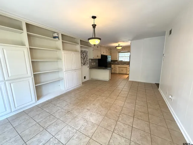 a large white bed in a white room