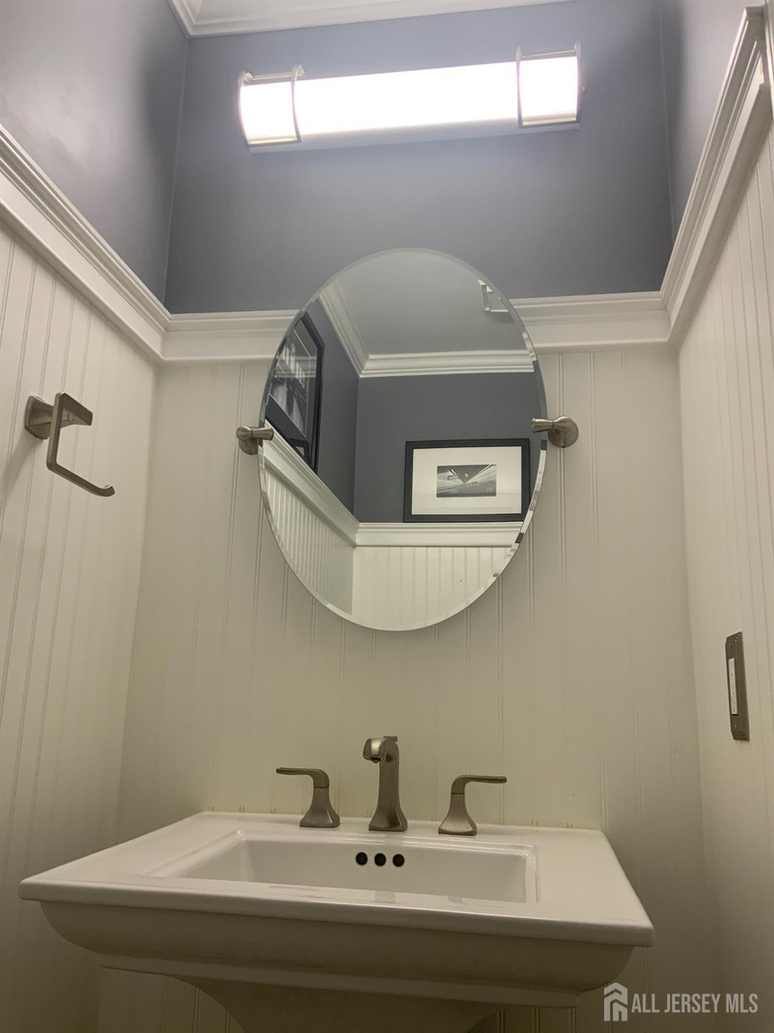 52 Wexford Drive Monmouth Junction, NJ 08852 - Photo 19 of 52 a bathroom with a sink and mirror