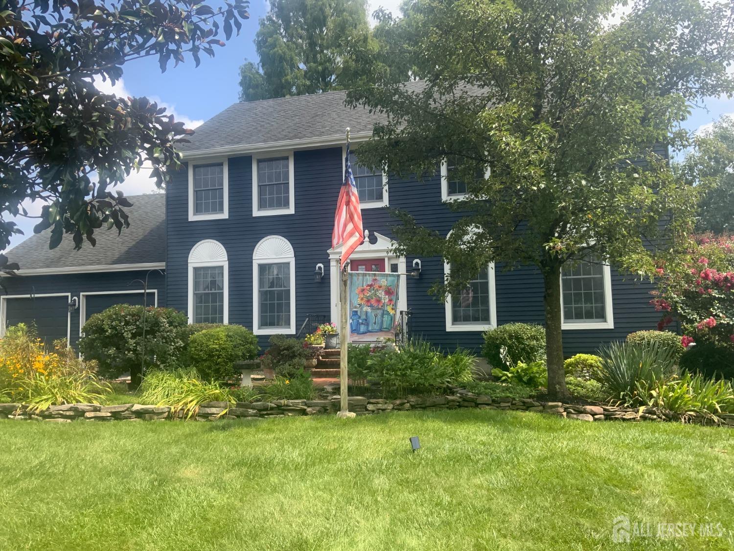 52 Wexford Drive Monmouth Junction, NJ 08852 - Photo 2 of 52 a front view of house with yard and green space