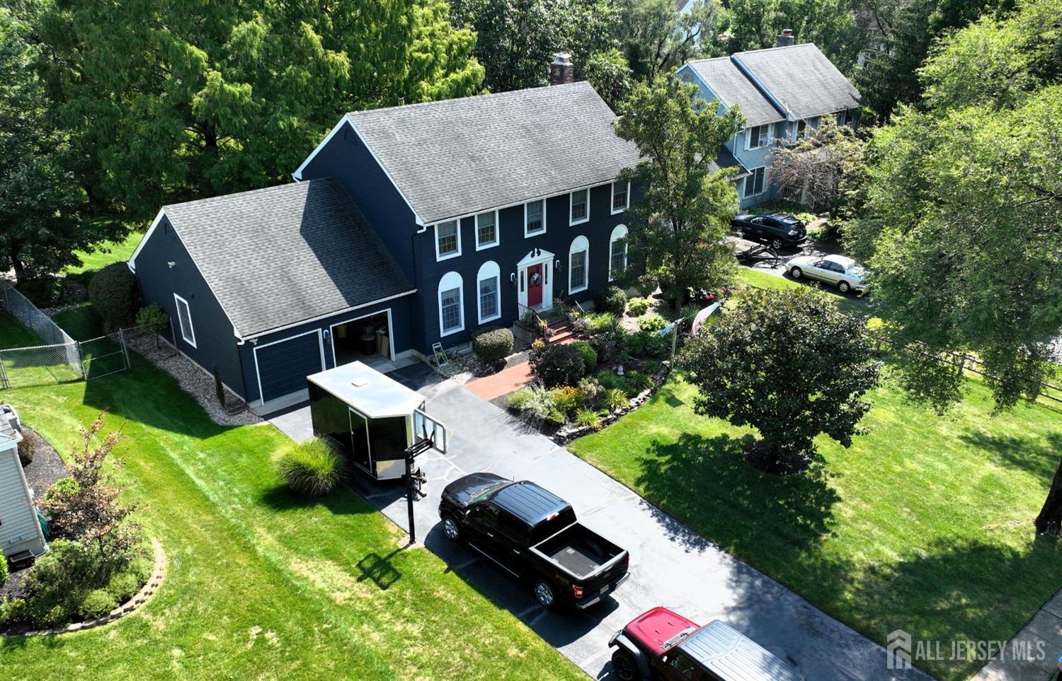 52 Wexford Drive Monmouth Junction, NJ 08852 - Photo 3 of 52 an aerial view of a house roof deck with chairs and a yard