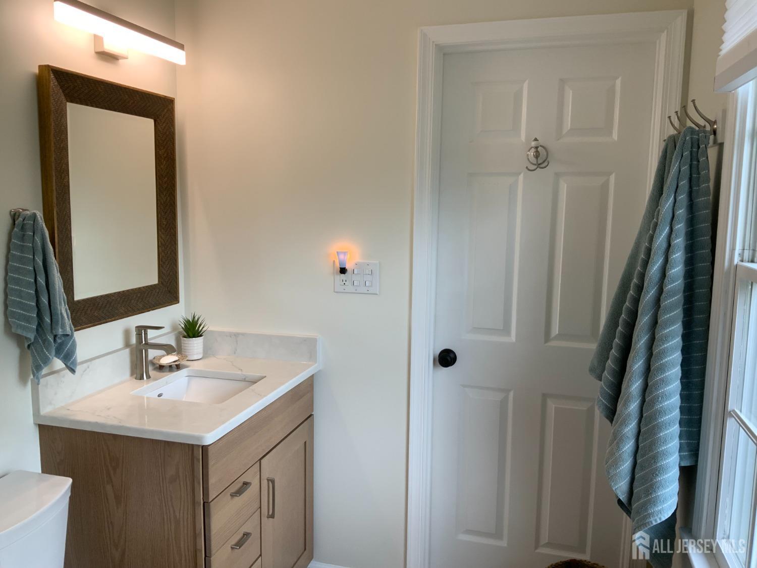 52 Wexford Drive Monmouth Junction, NJ 08852 - Photo 31 of 52 a bathroom with a sink and a mirror