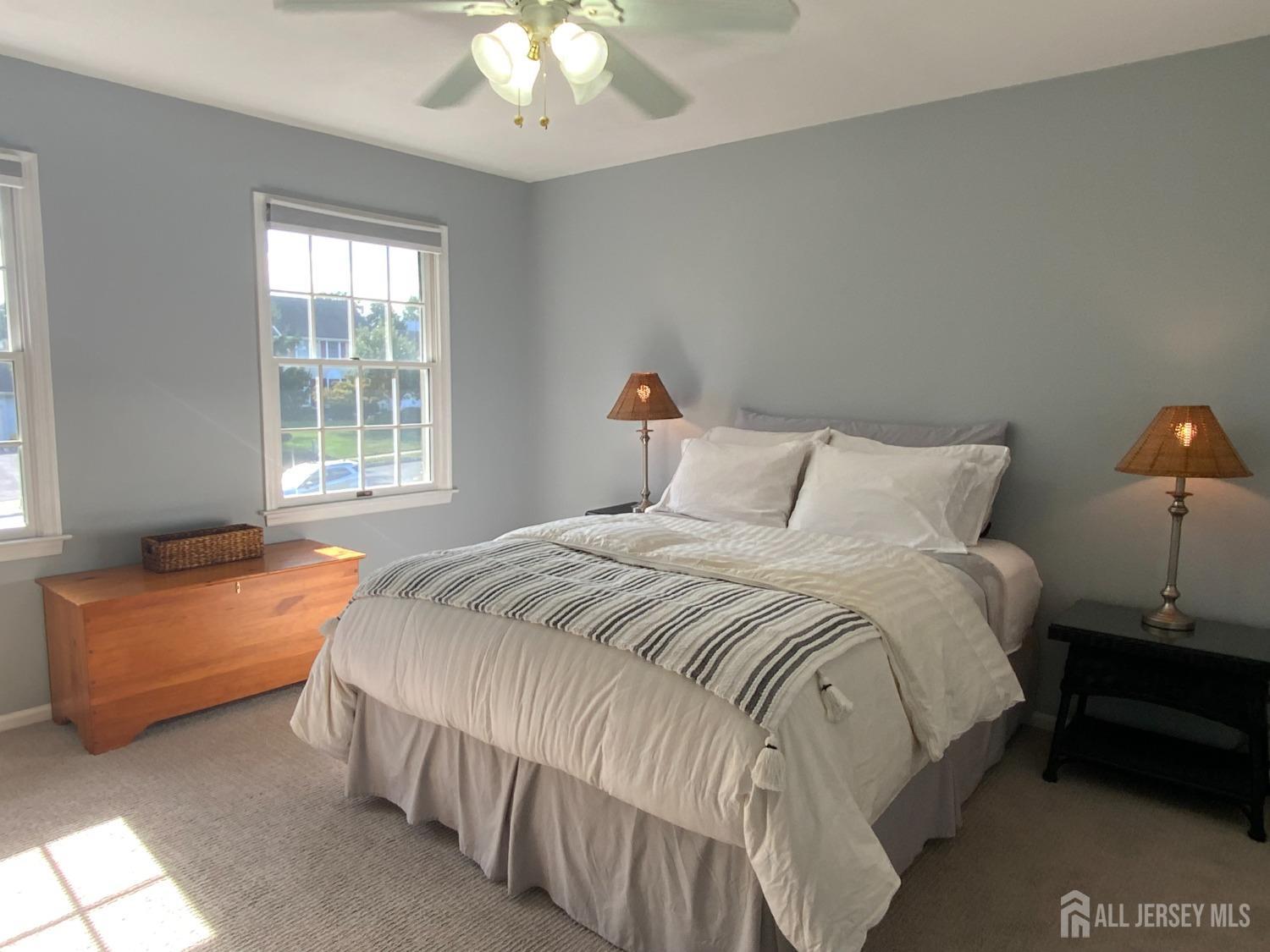 52 Wexford Drive Monmouth Junction, NJ 08852 - Photo 39 of 52 a bedroom with a bed and a chandelier