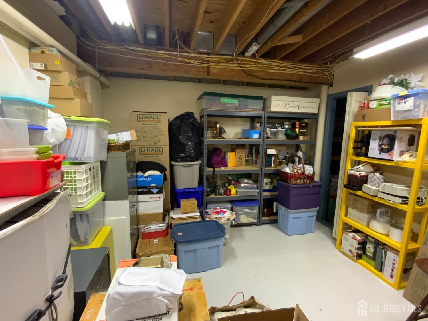 52 Wexford Drive Monmouth Junction, NJ 08852 - Photo 43 of 52 a room with furniture and a store room