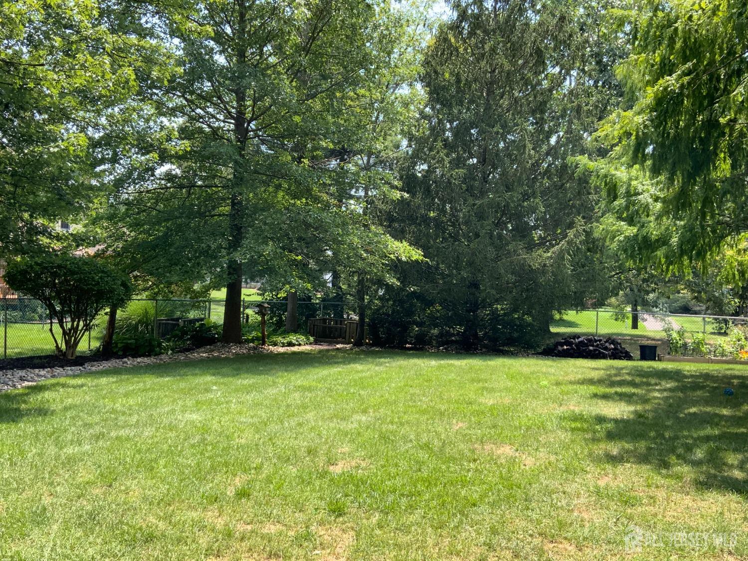 52 Wexford Drive Monmouth Junction, NJ 08852 - Photo 49 of 52 a view of a park with trees in the background