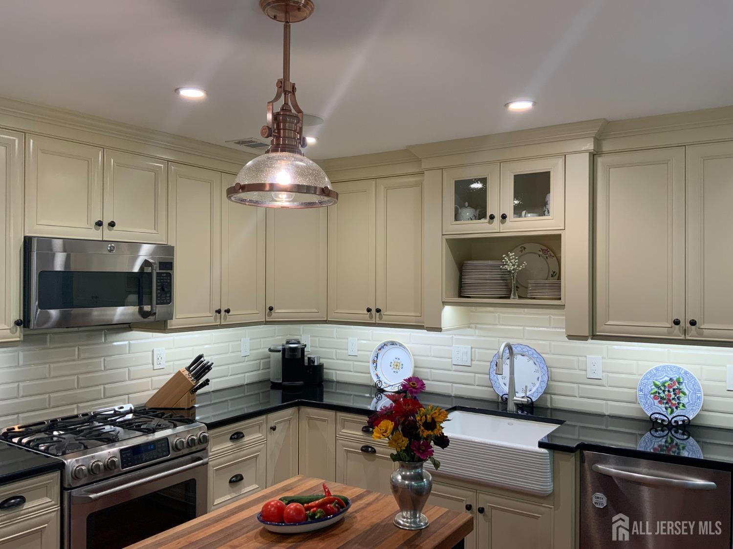 52 Wexford Drive Monmouth Junction, NJ 08852 - Photo 8 of 52 a kitchen with a stove a sink and a microwave