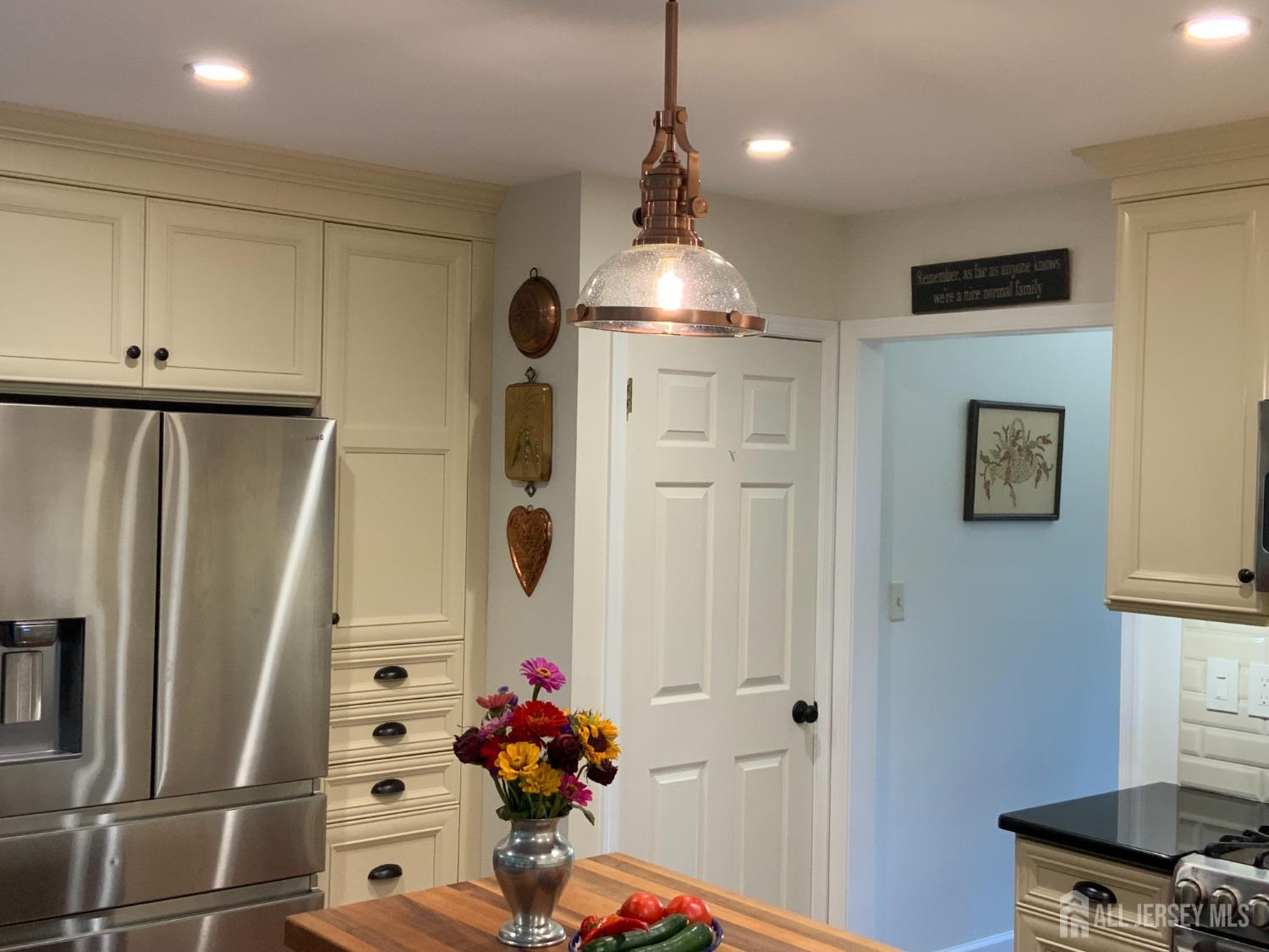 52 Wexford Drive Monmouth Junction, NJ 08852 - Photo 9 of 52 a kitchen with stainless steel appliances a refrigerator and a window