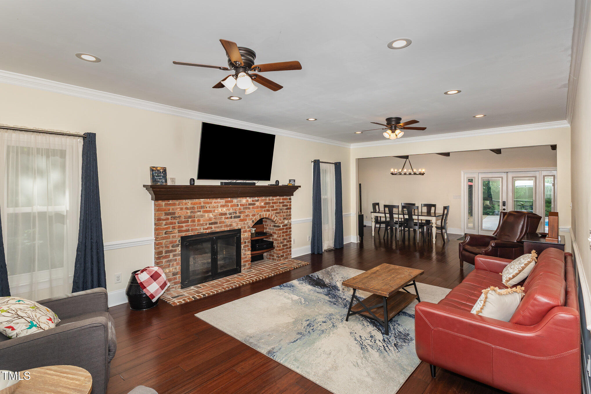 7901 Farnham Court Raleigh, NC 27615 - Photo 8 of 30 a living room with furniture and a fireplace
