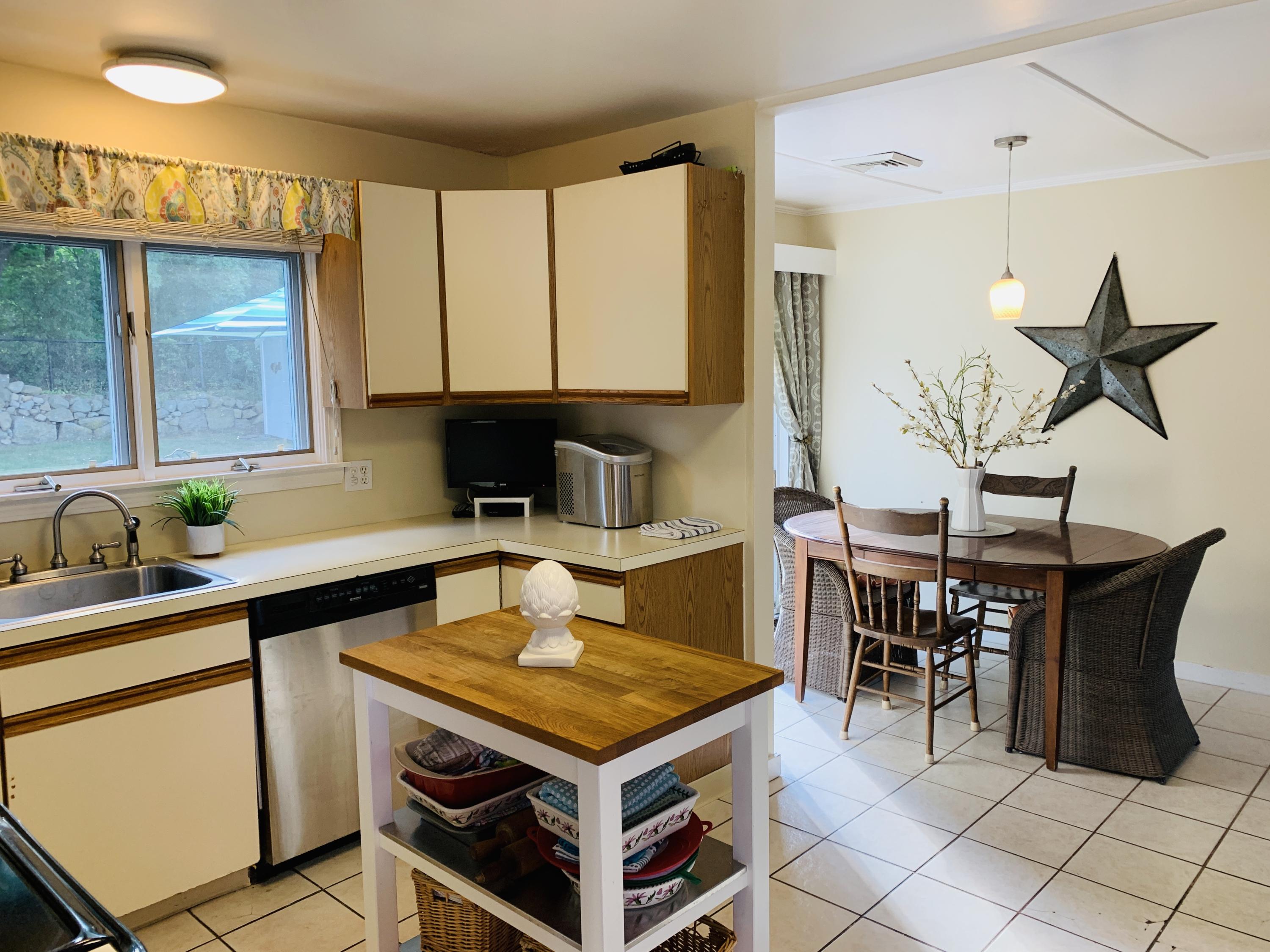 8 Morse Avenue Wareham, MA 02571 - Photo 10 of 14 a kitchen with a stove a sink and a cabinets