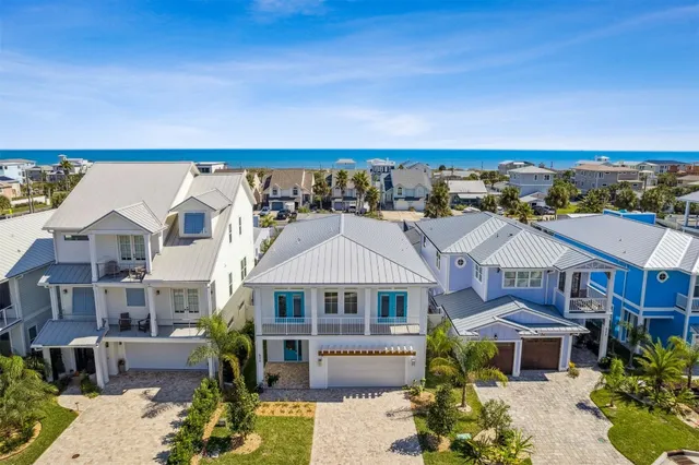 a kitchen with a table chairs stove and wooden floor