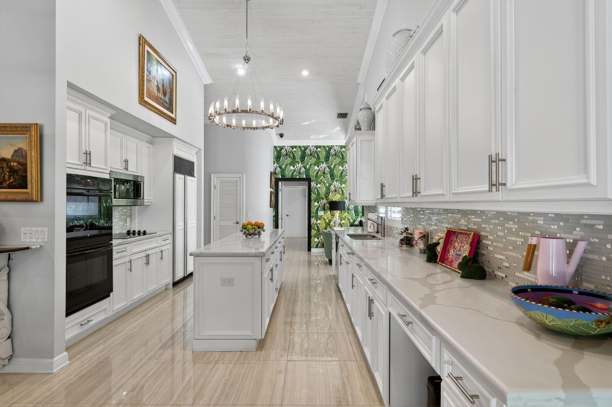 7205 Mandarin Drive Boca Raton, FL 33433 - Photo 16 of 71 a kitchen with stainless steel appliances lots of counter top space and wooden floor