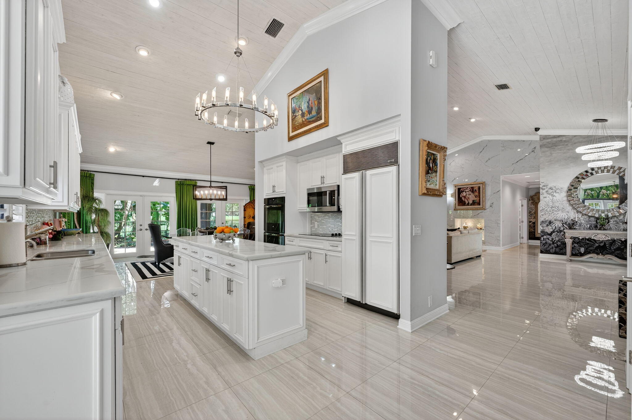 7205 Mandarin Drive Boca Raton, FL 33433 - Photo 17 of 71 a large white kitchen with lots of counter top space refrigerator and cabinets