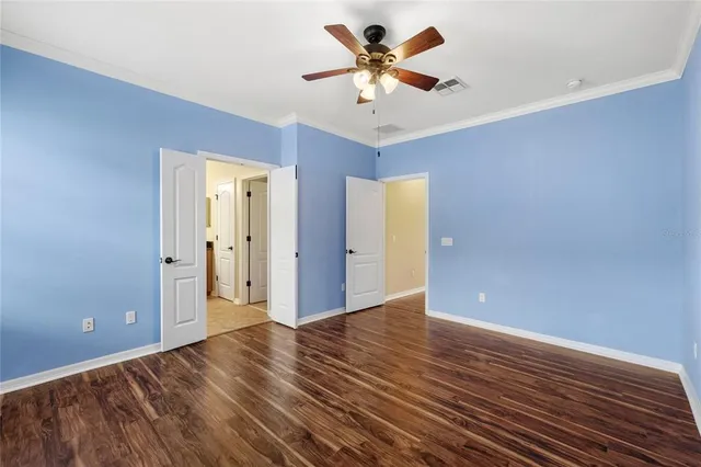 a spacious bathroom with a shower sink and mirror