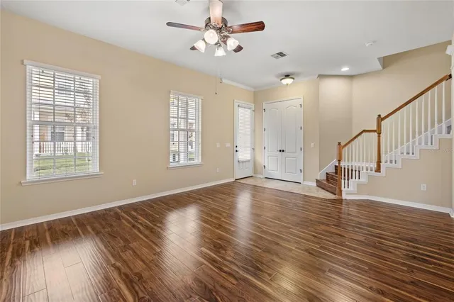 a view of an entryway with wooden floor