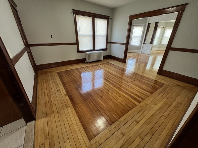 0 Lafayette Street, Unit 1 Fall River, MA 02723 - Photo 6 of 13 a view of an empty room with wooden floor and staircase
