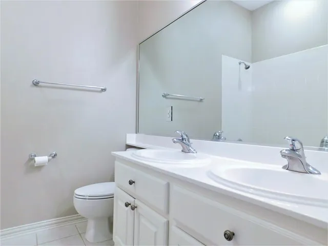 a bathroom with a sink a toilet and vanity