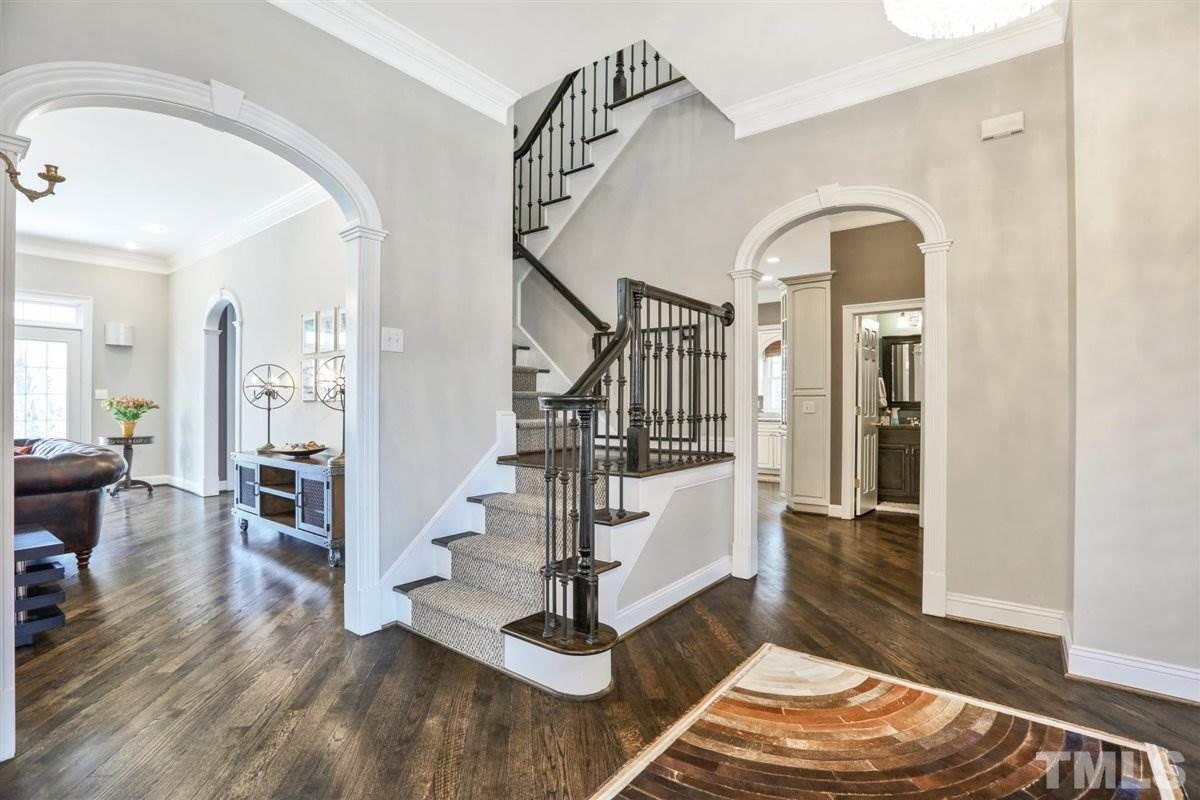 12317 Beestone Lane Raleigh, NC 27614 - Photo 14 of 30 a view of entryway and hall with wooden floor